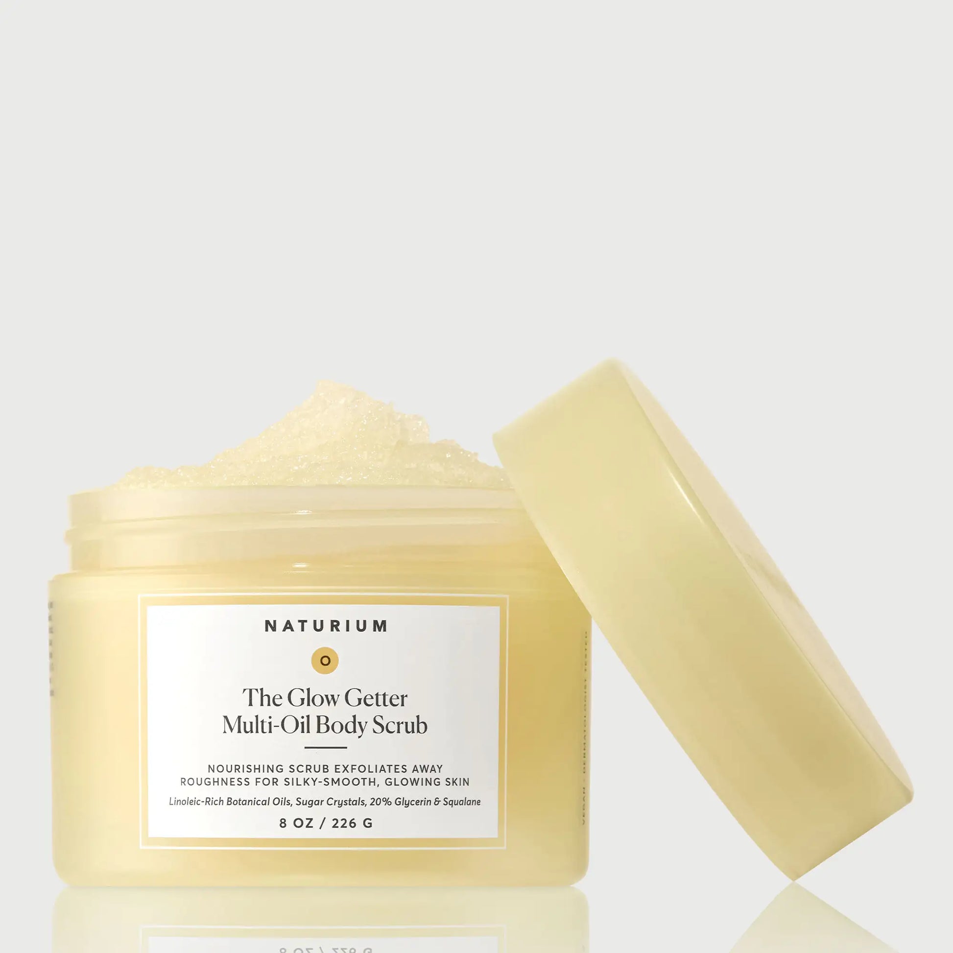 the-glow-getter-multi-oil-body-scrub-d4 NATR-40028-GlowGetter-Multi-Oil-Body-Scrub-Front-CapOff-bonebkgd.webp